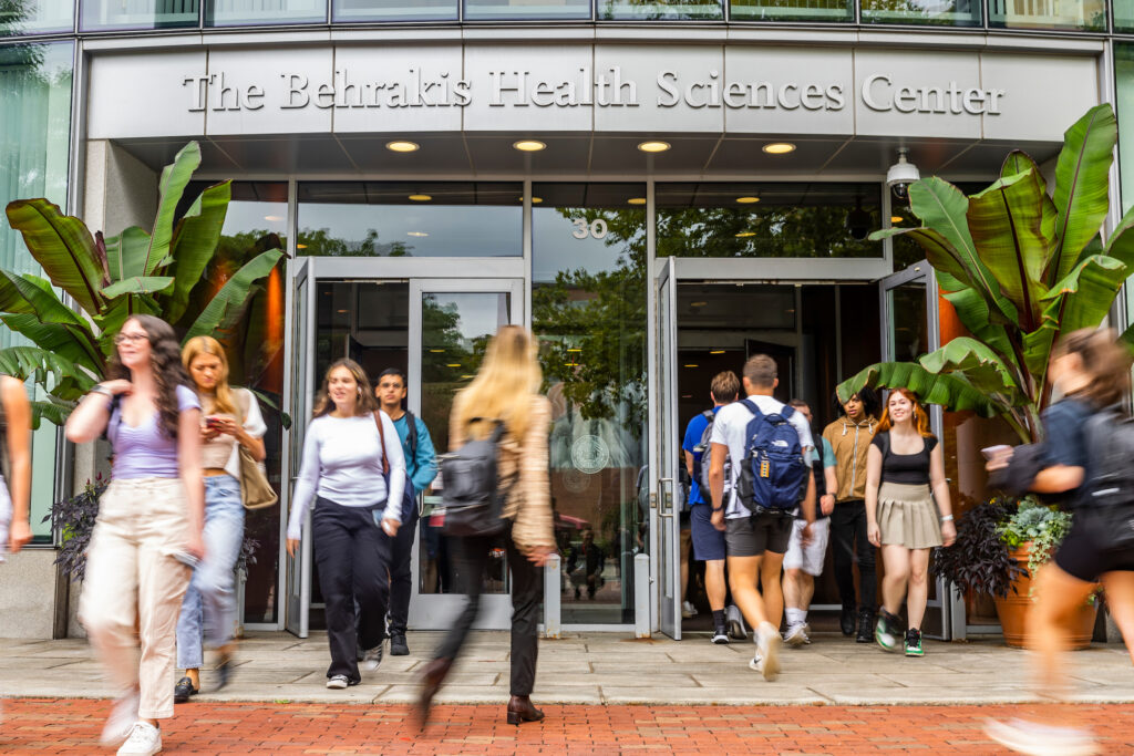Students walking in and out of the Behrakis Health Sciences Center at Bouvé College of Health Sciences on Northeastern's Boston campus