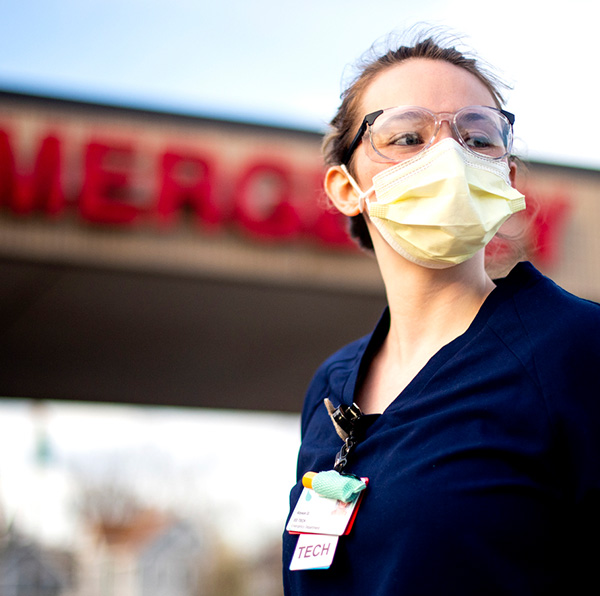 Nursing student in front of her coop at an emergency center