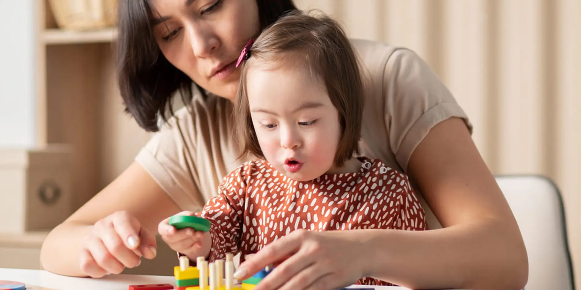 Applied behavior analysis professional with child assessing