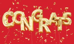 Balloon letters spelling out "congrats" against a red backdrop