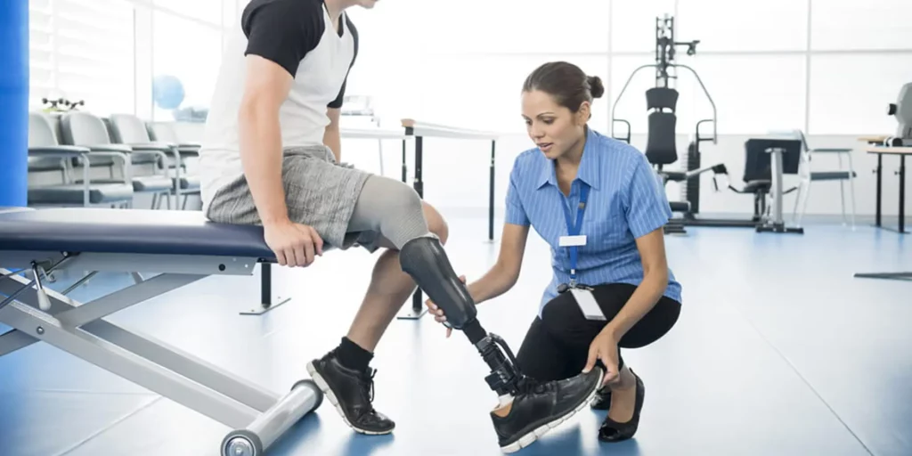 A rehabilitation engineer is aiding patient with a bionic leg. They are in a medical facility.