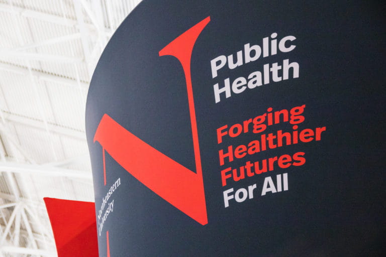 Northeastern University Public Health sign at the American Public Health Association Conference (APHA)