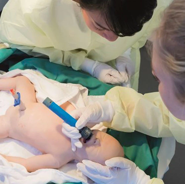 Nursing students intubating a sim baby