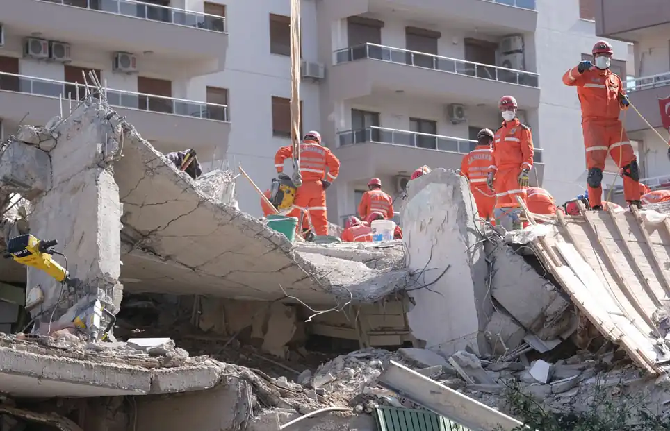 Earthquake scene with experts looking for survivors in rubble