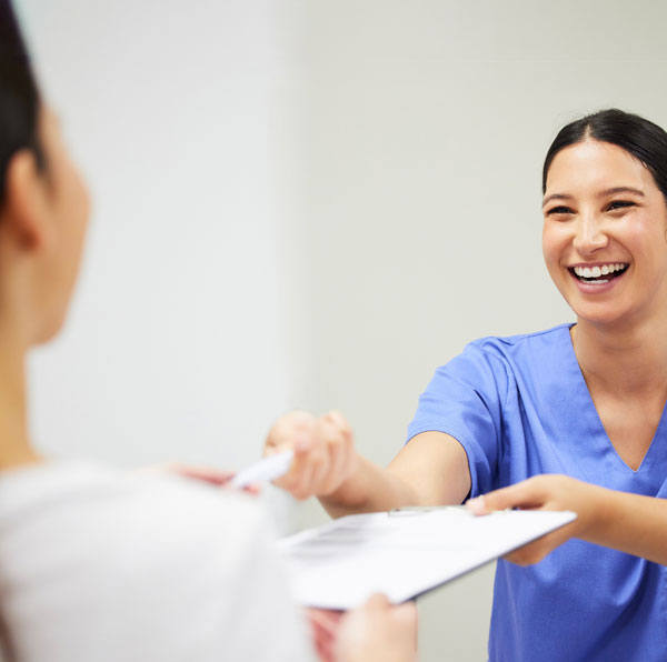 Physician assistant interacting with patient