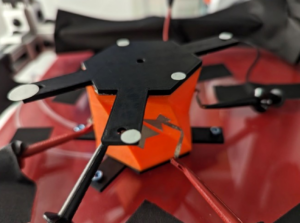 Origami robot during a test. The black hexagon on the front of the robot is used for optical tracking. Photo credit: Sonia Roberts