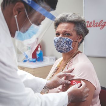 Woman getting vaccination at Walgreens