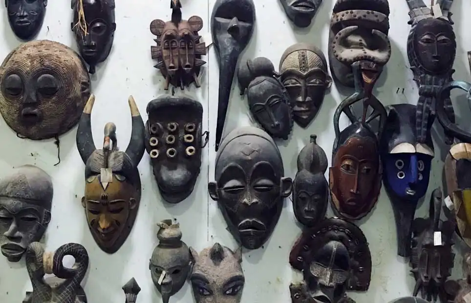 Masks from Ghana hanging on a wall