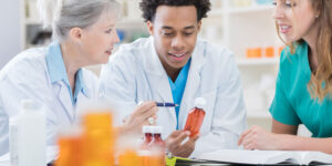 Two pharmacists precepting a student pharmacist