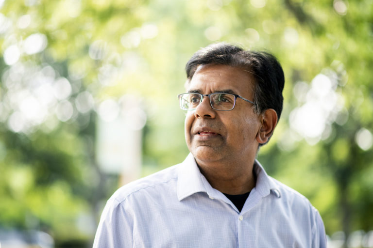 Outdoor portrait photo of Mansoor Amiji, Distinguished Professor and Chair of the Department of Pharmaceutical Sciences