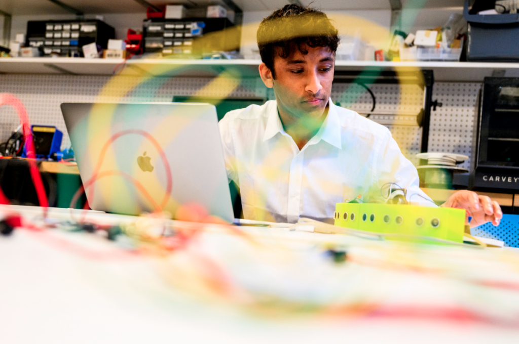 Hari Narayanam and his team developed a sensor system that alerts a wheelchair user if they are at risk of backing into something. Photo by Matthew Modoono/Northeastern University