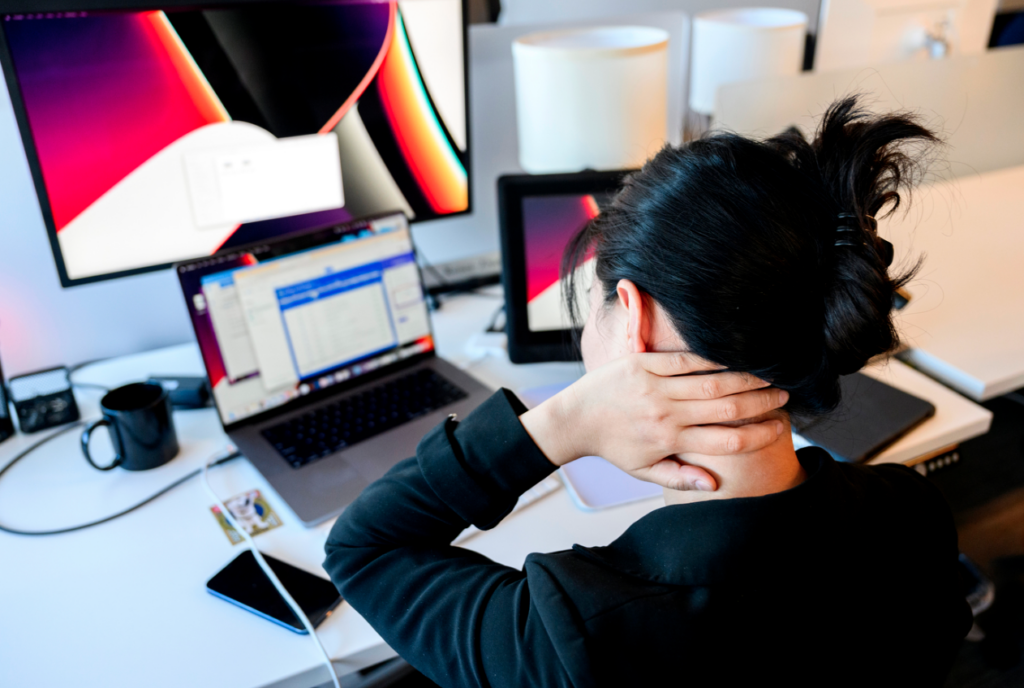 Bending over laptops, cell phones and tablets has created an epidemic of “tech neck” among adults and kids, but remedies exist. Photo by Matthew Modoono/Northeastern University