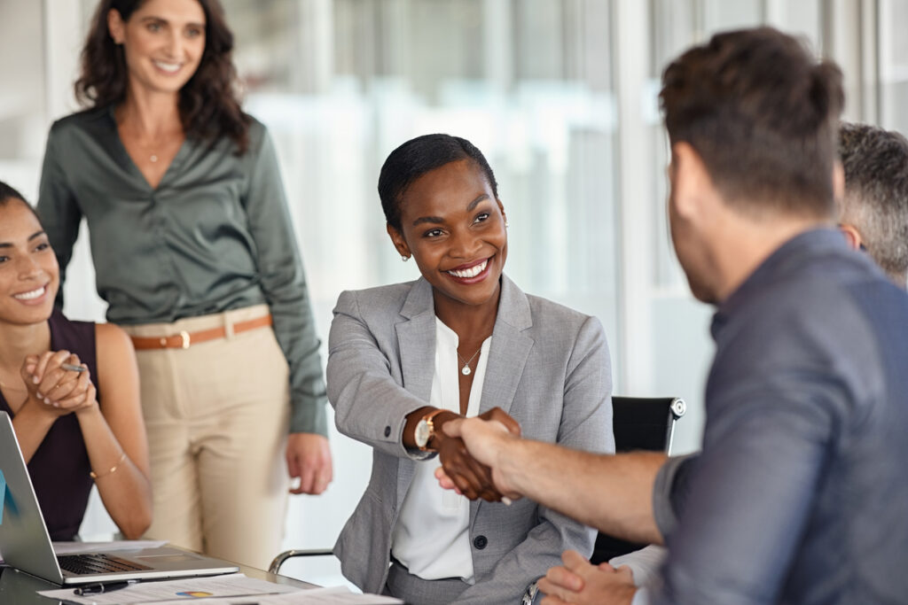 Businesswoman shaking hands with new business partner