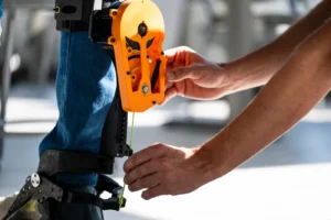 Max Shepherd, assistant professor, works on an exoskeleton with graduate student Divyansh Gupta in Richards Hall on Northeastern’s Boston campus. Photo by Alyssa Stone/Northeastern University