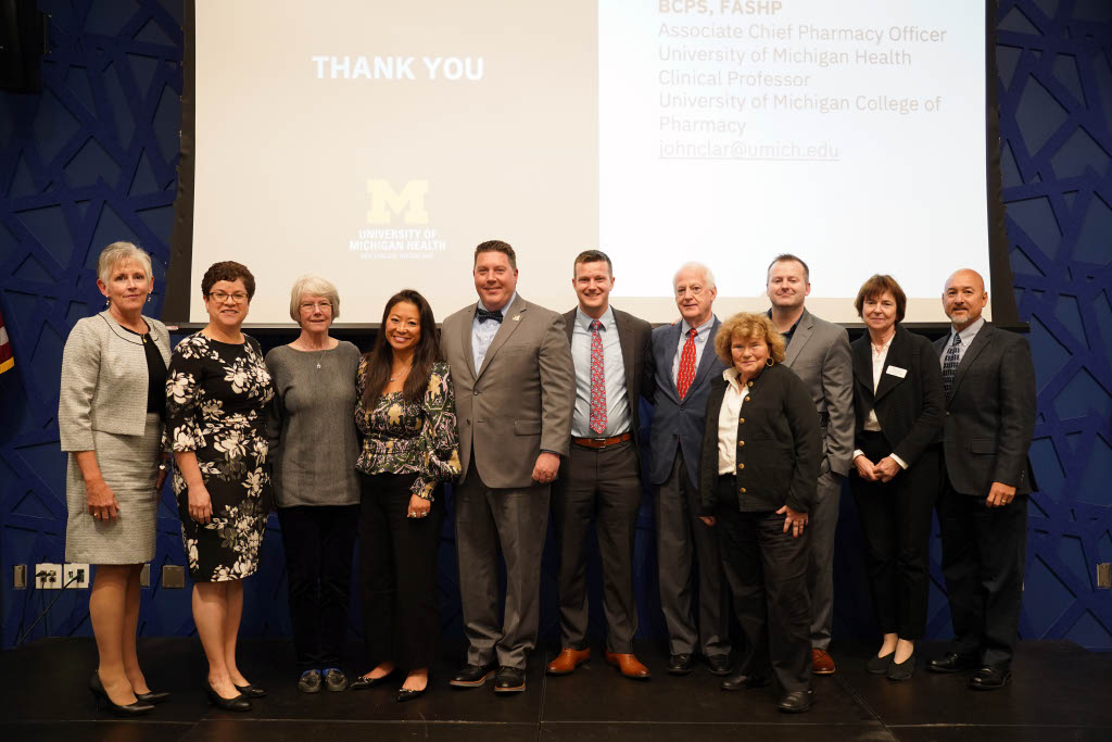 The 40th Annual Webb Lecture, October 28, 2024. Pictured left to right: Leigh Briscoe-Dwyer (ASHP President); Carmen Sceppa (Dean of Bouve); Bonnie Webb (Daughter of John Webb); Rebecca Bartlett (Webb family member); John Clark (2024 Webb recipient); Tom Webb (Grandson of John Webb); Bob Webb (Son of John Webb); Susie Webb (Bob Webb’s spouse); Gus Webb (Grandson of John Webb); Tatiana Bronich (Dean of SOPPS); David Chen (ASHP Assistant Vice President for Pharmacy Leadership and Planning)