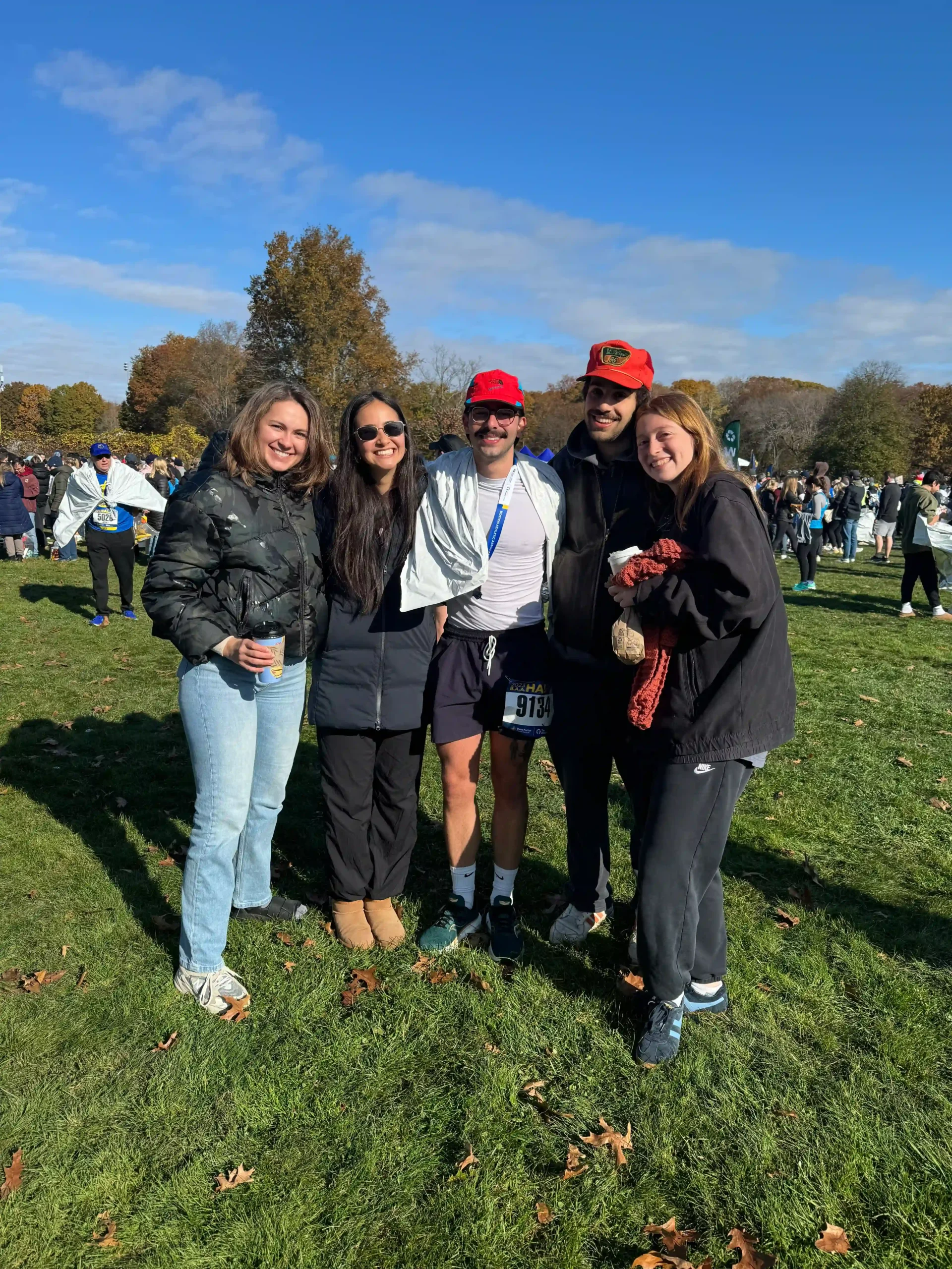Bouvé PharmD student Sebastien Chenin surrounded by friends after running the Boston Half Marathon (Photo credit: Sebastian Chenin)