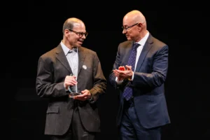 Northeastern President Joseph E. Aoun applauds Matthew Miller, recipient of the University Distinguished Professor Award. Photo by Alyssa Stone/Northeastern University