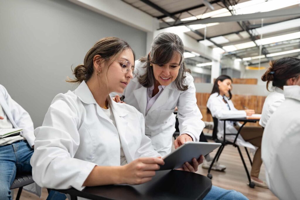 A student receiving instructions from a mentor.