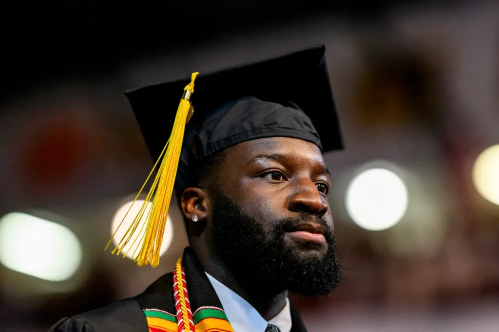 Graduate walks in to the Bouvé College Celebration