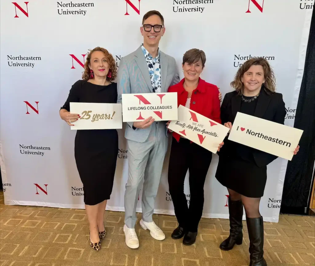 From left: School of Pharmacy and Pharmaceutical Sciences' Margarita DiVall, Mike Gonyeau, Jenny Van Amburgh, and Jenn Kirwin celebrating after surpassing 25 years at Northeastern