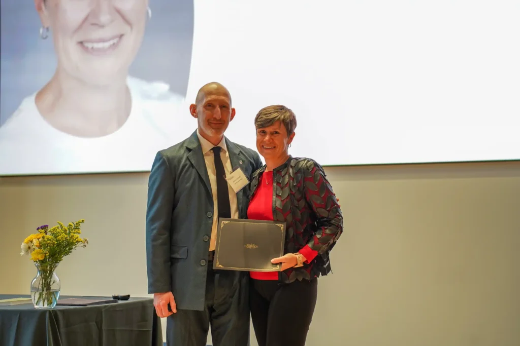 School of Pharmacy and Pharmaceutical Sciences' Jason Lancaster presents Dr. Jenny Van Amburgh with the SOPPS Distinguished Service Award