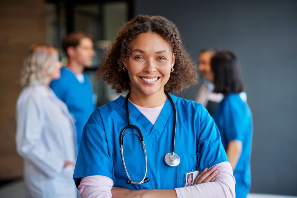 A nurse smiling at the camera.