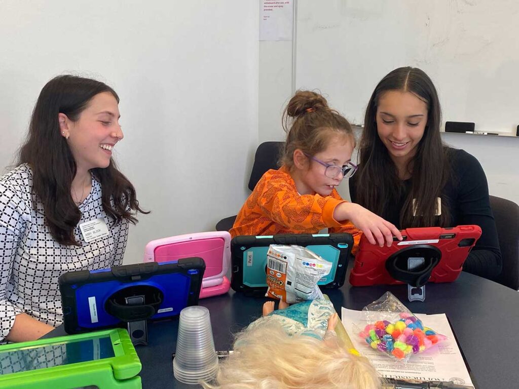 Speech-language pathology students in action