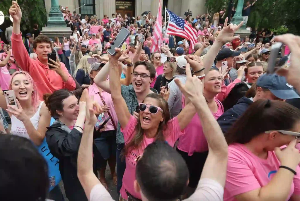 Photo of supporters cheering after hearing the verdicts for the Karen Read trial