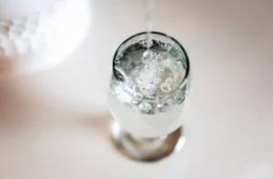 Stock photo of water being poured into a glass