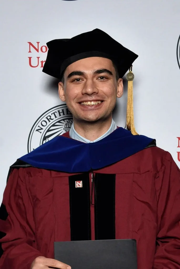 Population Health PhD alumnus Dr. Farbod Alinezhad poses for a photo at graduation
