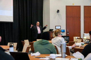 Photo of Health Sciences Entrepreneurship Minor program director Eugene Buff speaking in front of a group at the Extreme Cold Symposium
