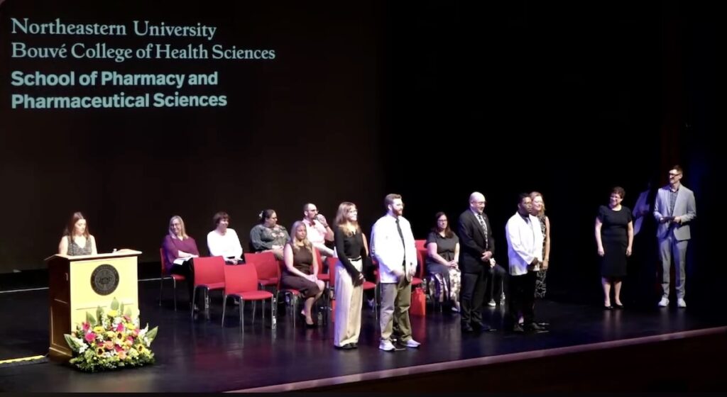 School of Pharmacy and Pharmaceutical Sciences students pose for a photo after being given their White Coat