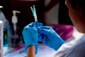 Photo of a medical expert prepping a vaccine