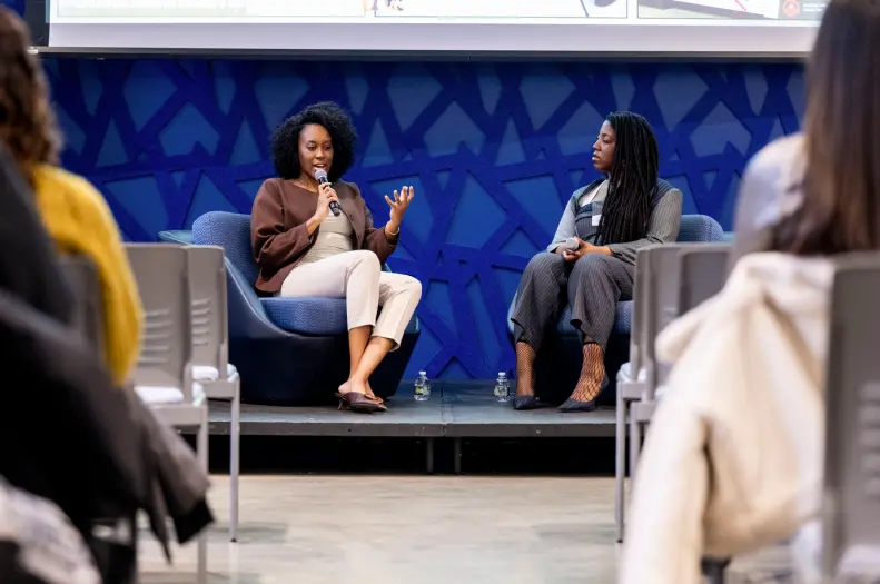 Northeastern alums Cynthia Orofo and Adebukola Ajao speak at a forum at the John D. O’Bryant African American Institute.